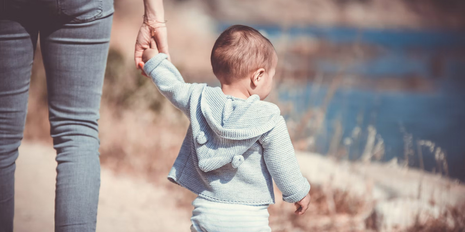 Mother walking with young child